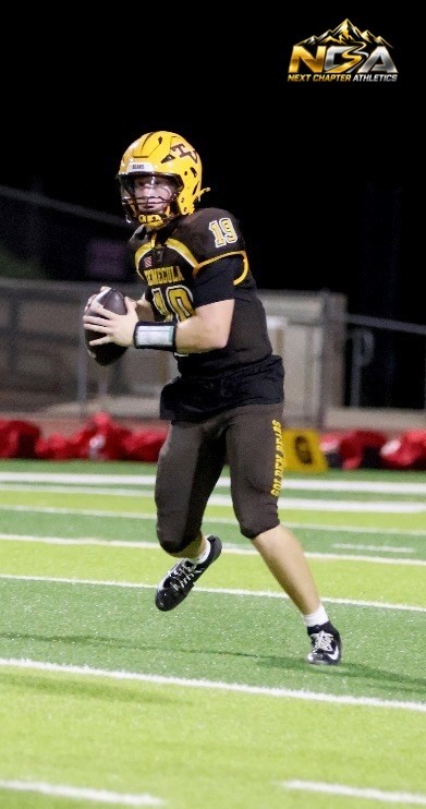 Caden Chrisman carrying the football